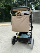 Sportive Wickeltasche in modernem reduzierten Look aus beigem Nylon mit verstellbarem Henkel am Kinderwagenbügel